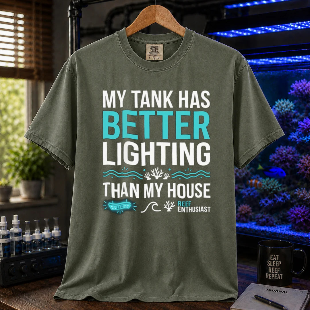 Saltwater aquarium graphic t-shirt featuring bold typography and reef icons with the text: MY TANK HAS BETTER LIGHTING THAN MY HOUSE, military green crew neck tee