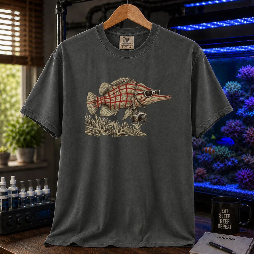 Saltwater aquarium graphic t-shirt featuring a vintage illustration of a Longnose Hawkfish wearing sunglasses and a camera over a coral reef, khaki crew neck tee