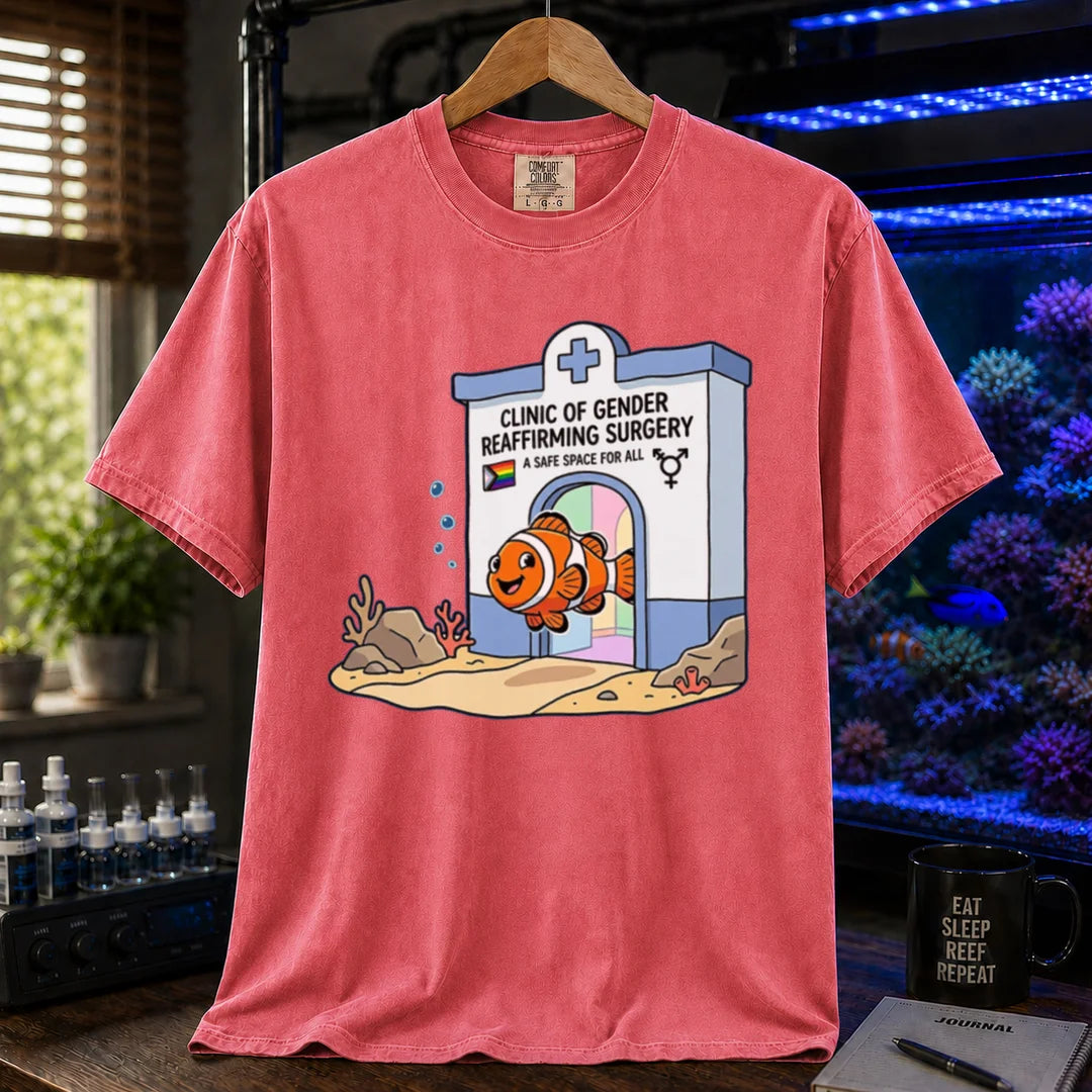 Saltwater aquarium graphic t-shirt featuring a clownfish coming out of a clinic for gender-affirming surgery, pink crew neck tee