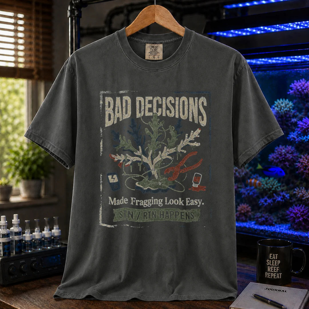 Saltwater aquarium graphic t-shirt featuring a distressed fragging illustration with tools and text: BAD DECISIONS Made Fragging Look Easy. STN / RTN HAPPENS, khaki crew neck tee
