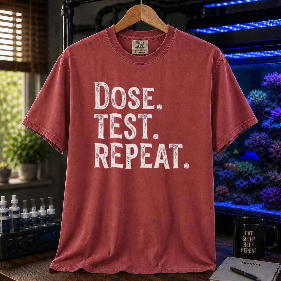 Saltwater aquarium graphic t-shirt featuring bold distressed text: DOSE. TEST. REPEAT., maroon crew neck tee