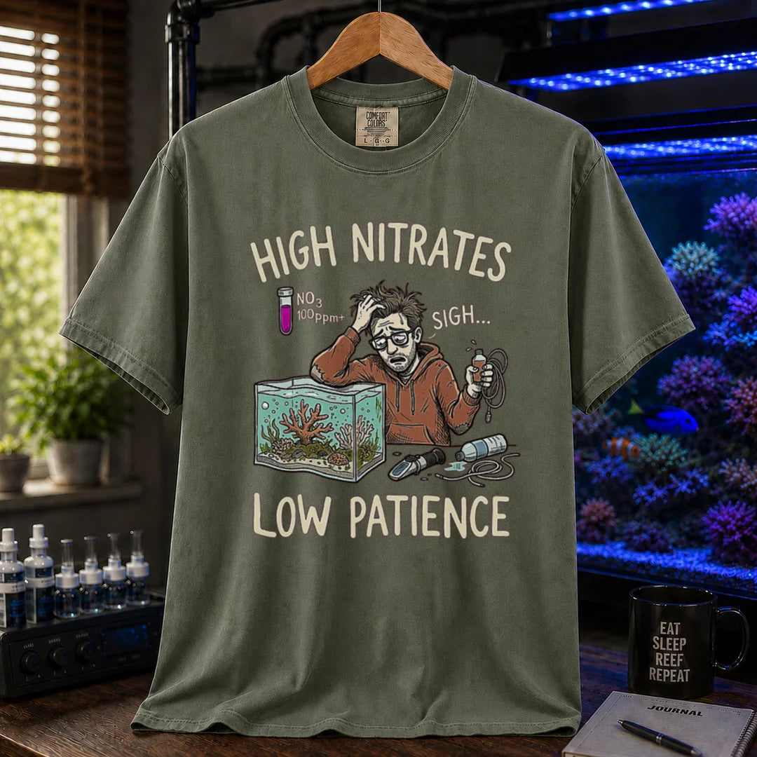 Saltwater aquarium graphic t-shirt featuring a stressed aquarist illustration and text: HIGH NITRATES LOW PATIENCE, military green crew neck tee