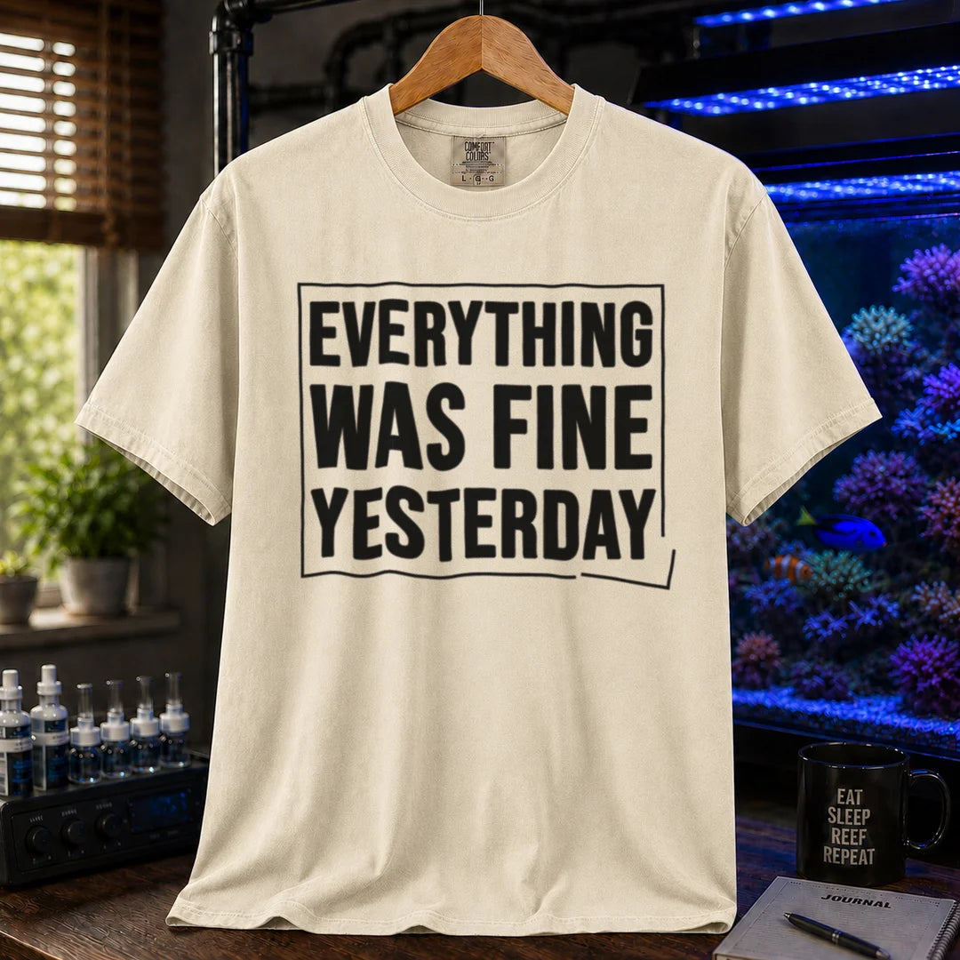 Saltwater aquarium graphic t-shirt featuring framed bold text: EVERYTHING WAS FINE YESTERDAY, cream, beige, ivory crew neck tee