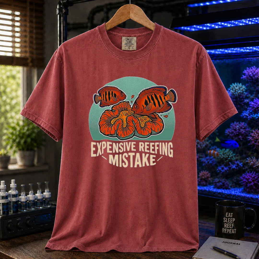 Saltwater aquarium graphic t-shirt featuring vibrant fish and coral illustrations and text: EXPENSIVE REEFING MISTAKE, maroon, red crew neck tee