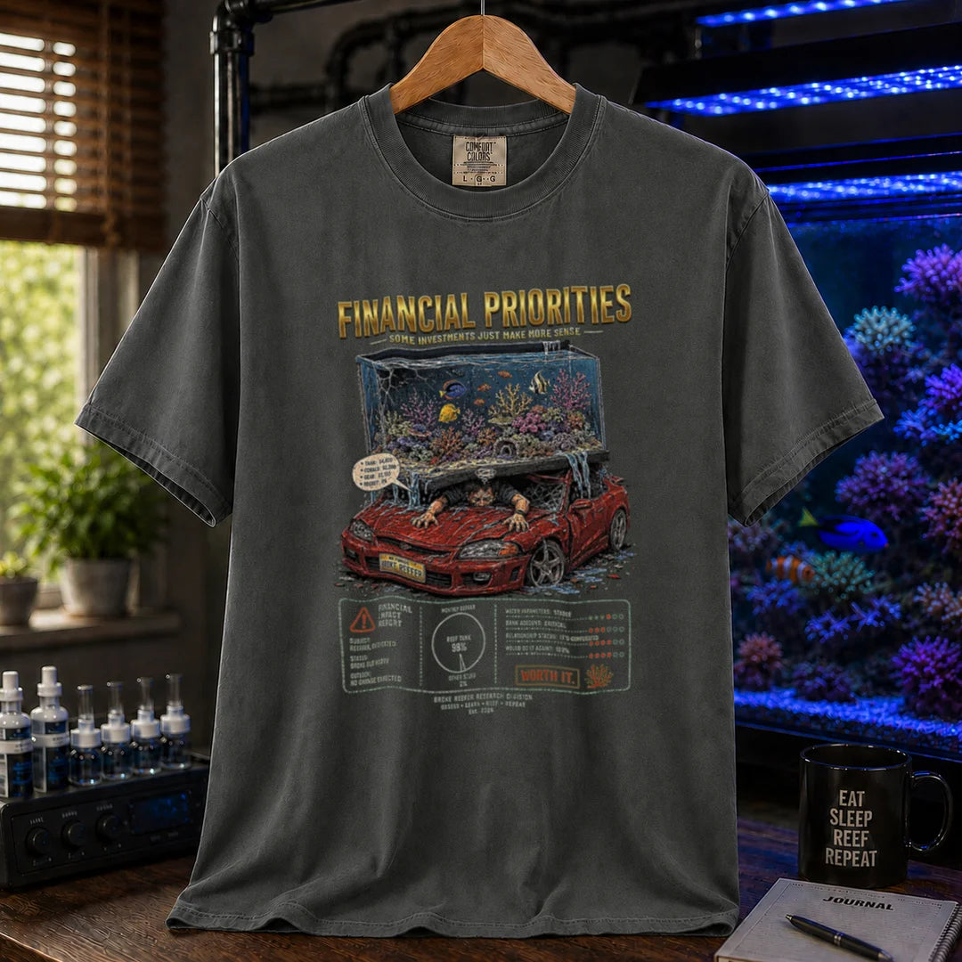 Saltwater aquarium graphic t-shirt featuring a reef tank crushing a car illustration and text: FINANCIAL PRIORITIES, dark grey crew neck tee