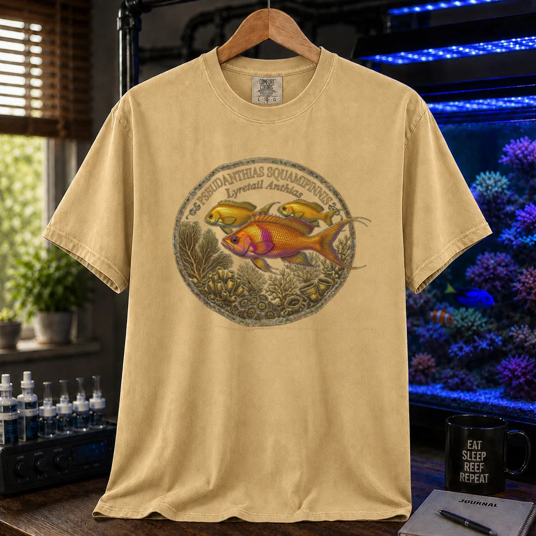 Saltwater aquarium graphic t-shirt featuring a Lyretail Anthias scientific illustration badge and text: PSEUDANTHIAS SQUAMIPINNIS Lyretail Anthias, mustard crew neck tee