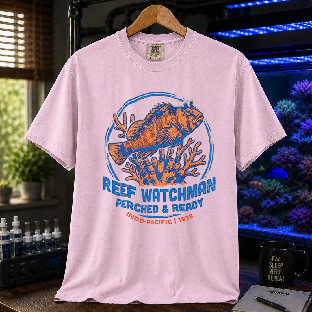 Saltwater aquarium graphic t-shirt featuring a fish perched on coral and text: REEF WATCHMAN PERCHED & READY INDO-PACIFIC 1978, pink crew neck tee