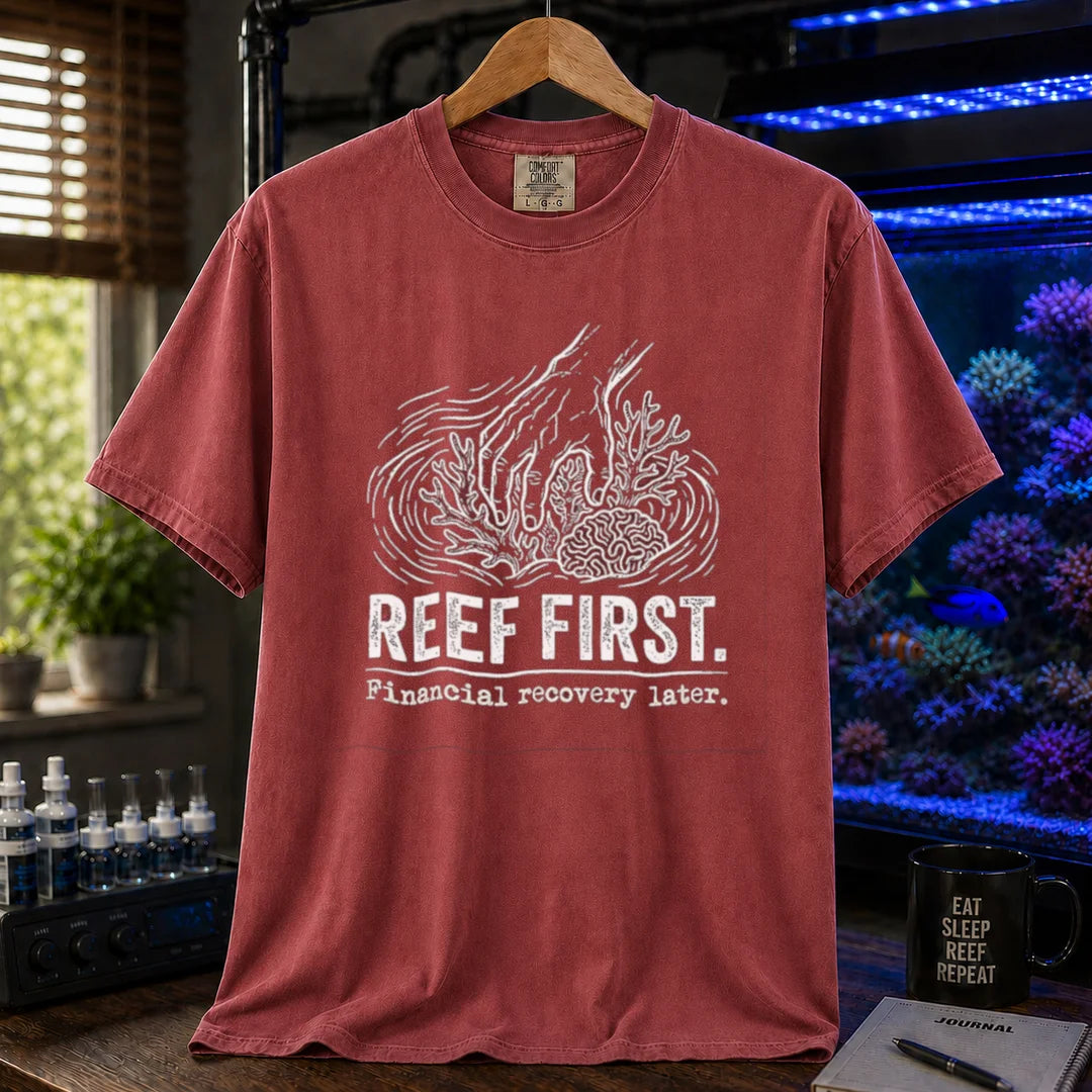 Saltwater aquarium graphic t-shirt featuring a hand tending corals illustration and text: REEF FIRST. Financial recovery later., maroon, red crew neck tee