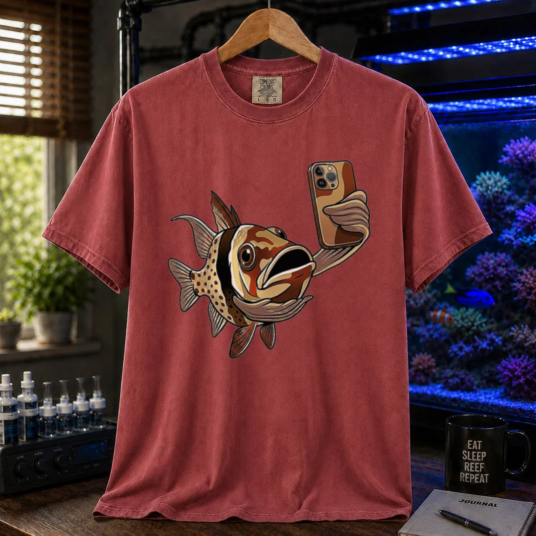 Saltwater aquarium graphic t-shirt featuring a pajama cardinalfish taking a selfie with a smartphone, maroon, red crew neck tee
