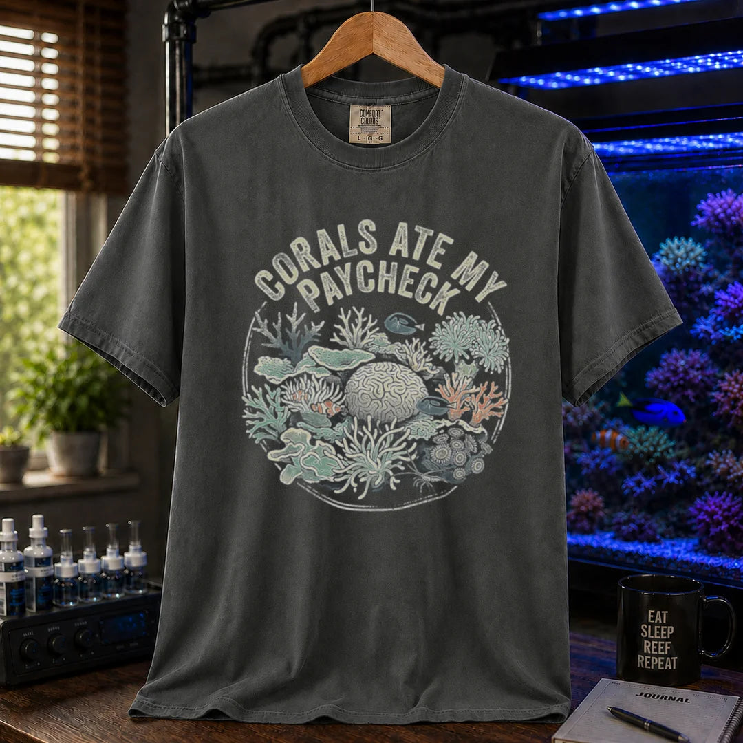 Saltwater aquarium graphic t-shirt featuring a circular coral reef illustration and text: CORALS ATE MY PAYCHECK, dark grey crew neck tee