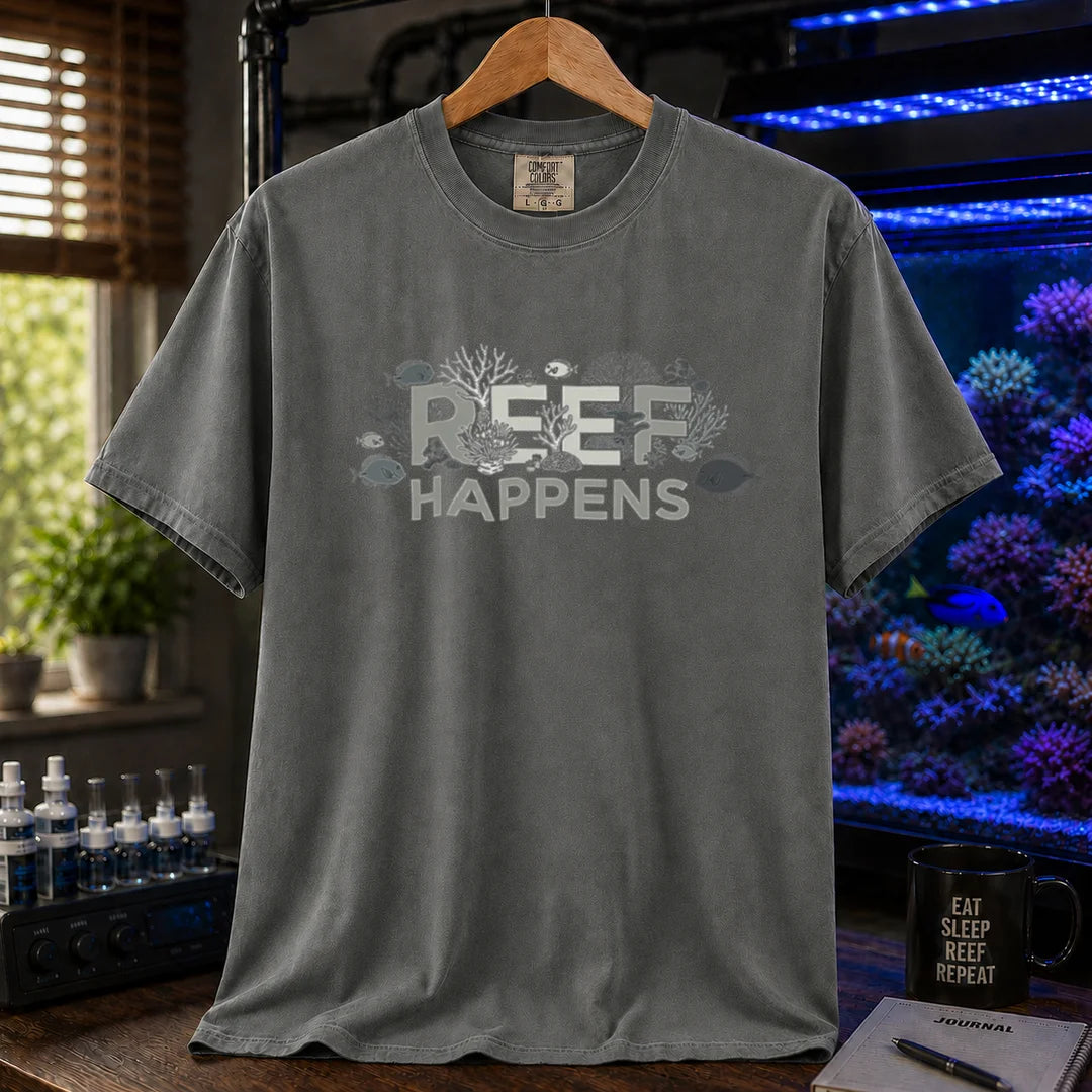Saltwater aquarium graphic t-shirt featuring text reading REEF HAPPENS with embedded coral and fish illustrations, dark grey crew neck tee