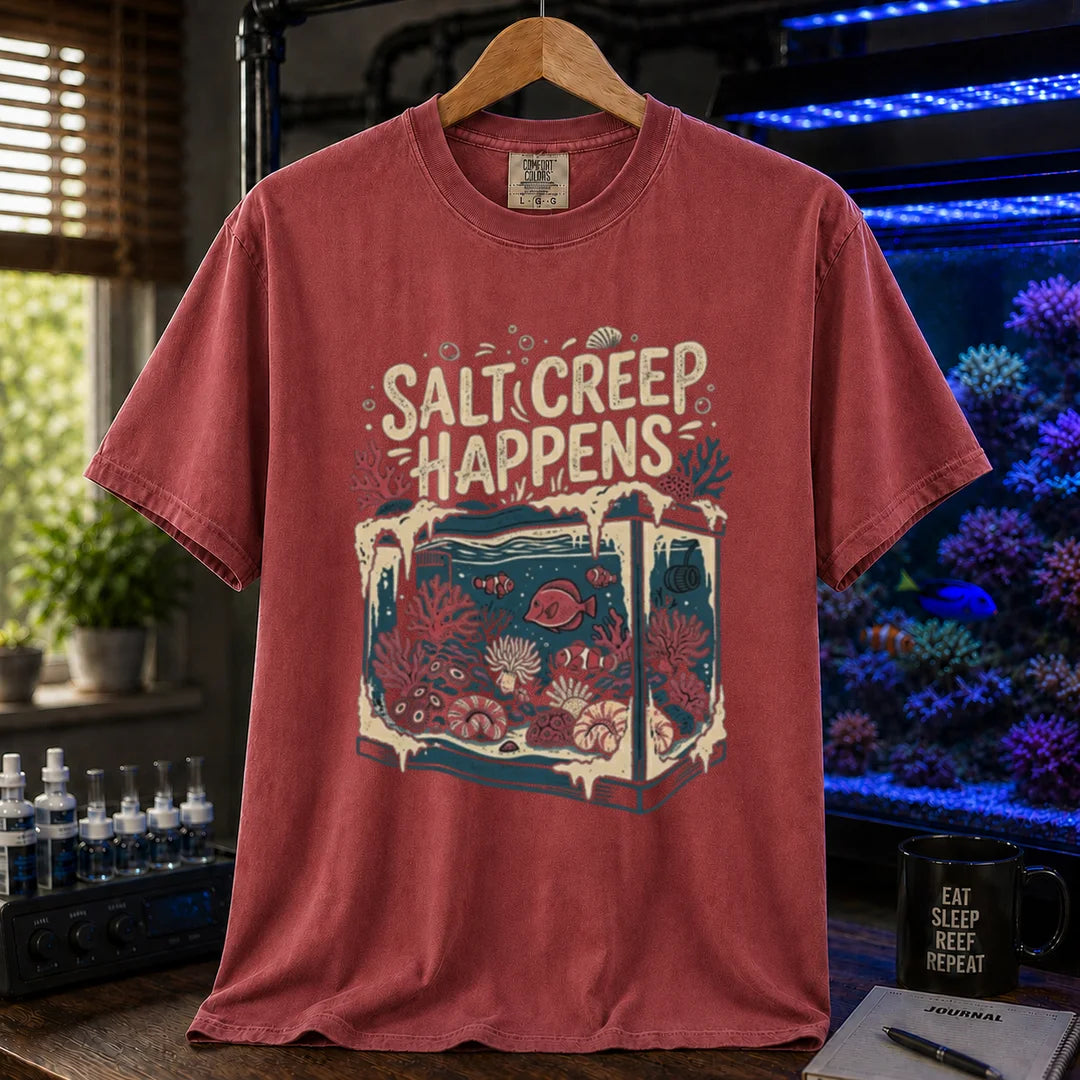 Saltwater aquarium graphic t-shirt featuring an illustration of a tank covered in salt buildup with text: SALT CREEP HAPPENS, maroon, red crew neck tee