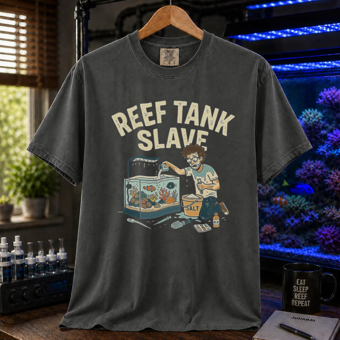 Saltwater aquarium graphic t-shirt featuring an aquarist maintaining a tank with a bucket of salt and text: REEF TANK SLAVE, dark grey crew neck tee