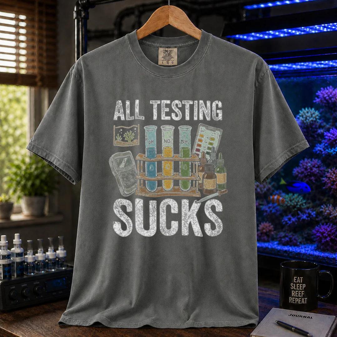 Saltwater aquarium graphic t-shirt featuring test tubes, reagent bottles, and text: ALL TESTING SUCKS, dark grey crew neck tee