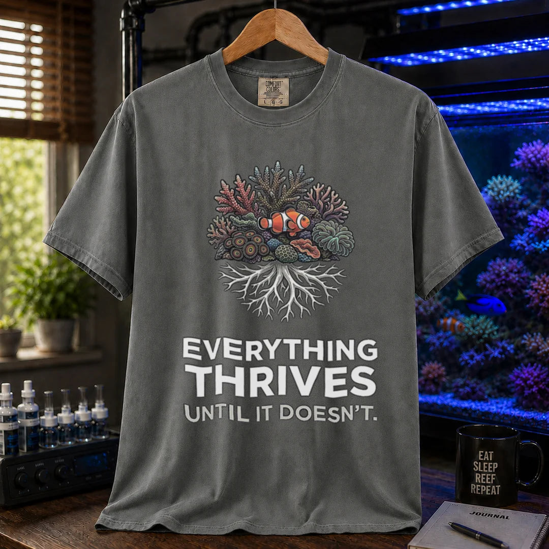 Saltwater aquarium graphic t-shirt featuring a coral reef cluster with a clownfish and text: EVERYTHING THRIVES UNTIL IT DOESN'T., dark grey crew neck tee