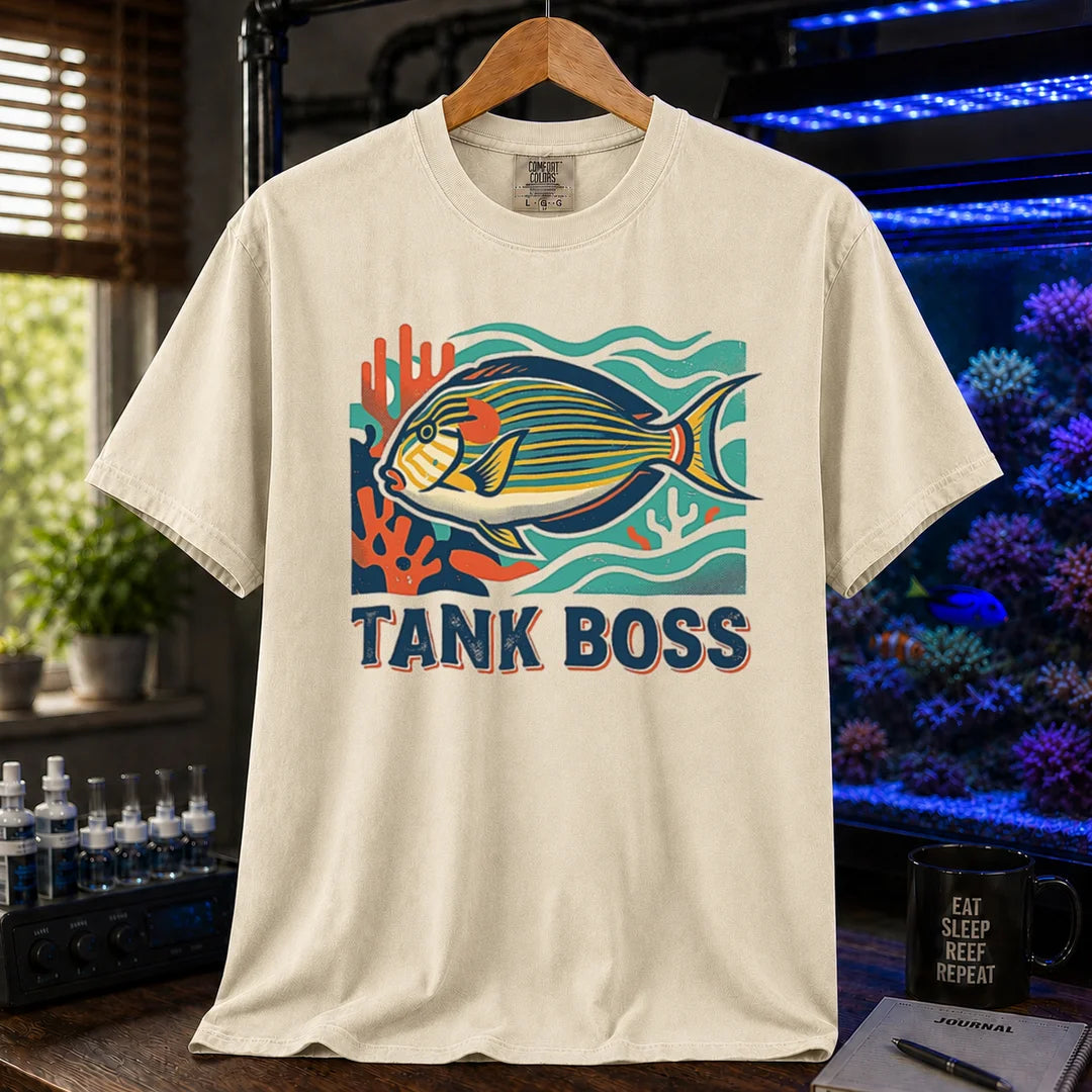 Saltwater aquarium graphic t-shirt featuring a retro illustration of a tang fish with coral and text reading TANK BOSS, cream, beige, ivory crew neck tee