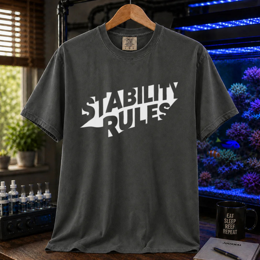 Saltwater aquarium graphic t-shirt featuring bold slanted block text reading STABILITY RULES, dark grey crew neck tee