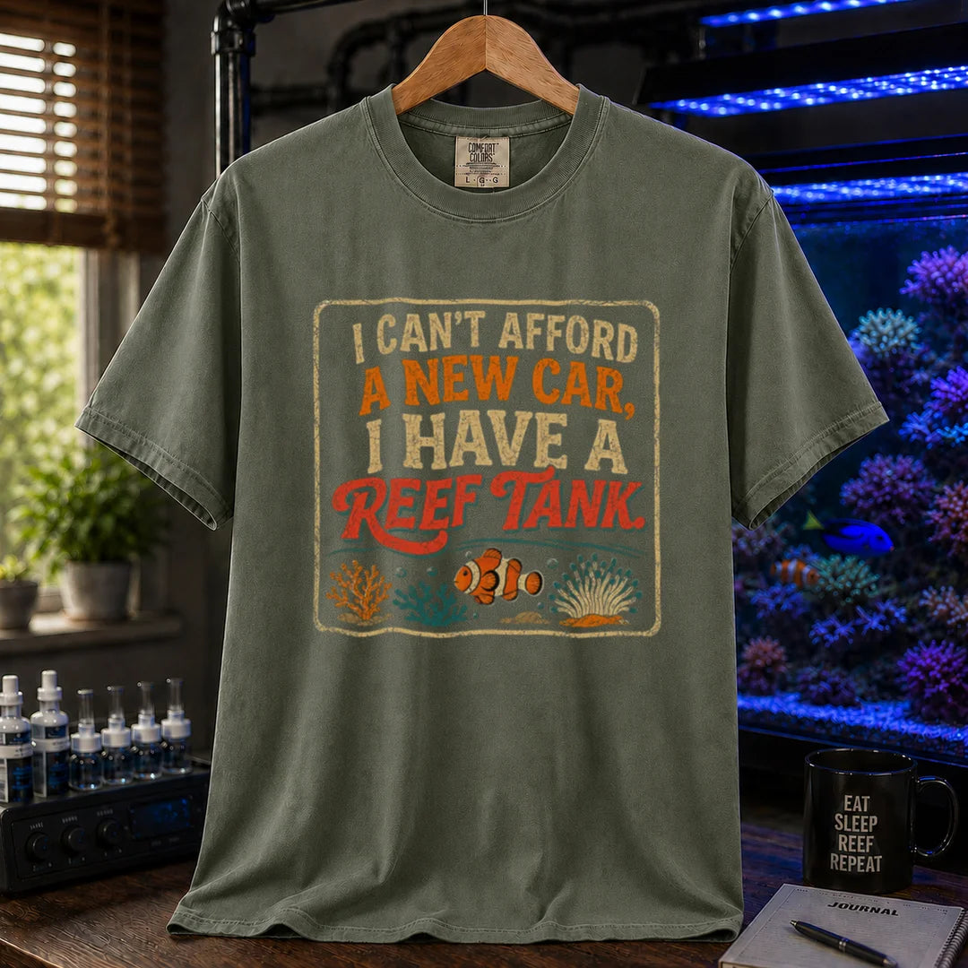 Saltwater aquarium graphic t-shirt featuring a vintage square design with text reading I Can't Afford a New Car, I Have a Reef Tank and a clownfish illustration, military green crew neck tee