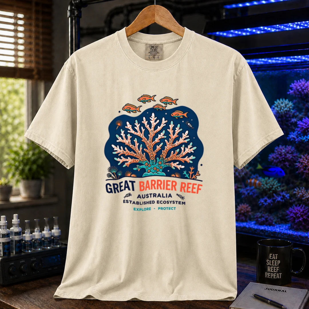 Saltwater aquarium graphic t-shirt featuring an illustration of a coral colony and fish with text reading Great Barrier Reef Australia Established Ecosystem Explore Protect, ivory crew neck tee