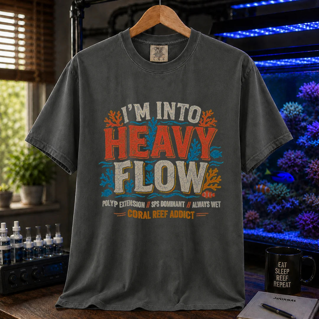 Saltwater aquarium graphic t-shirt featuring distressed retro typography reading I'm Into Heavy Flow with coral and fish illustrations and footer text, dark grey crew neck tee