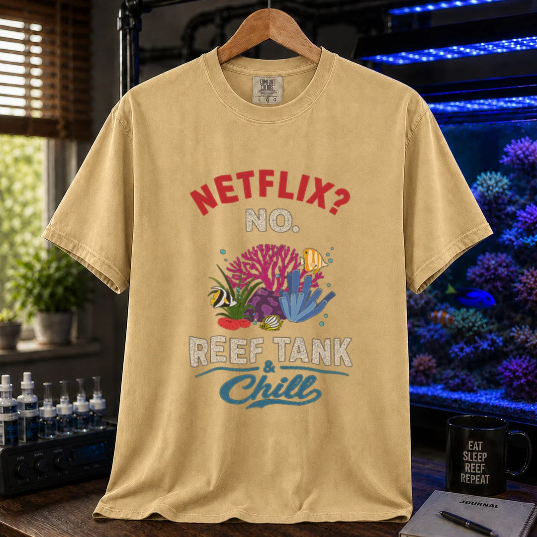 Saltwater aquarium graphic t-shirt featuring red and white typography reading Netflix? No. Reef Tank & Chill with a colorful coral and fish illustration, mustard crew neck tee
