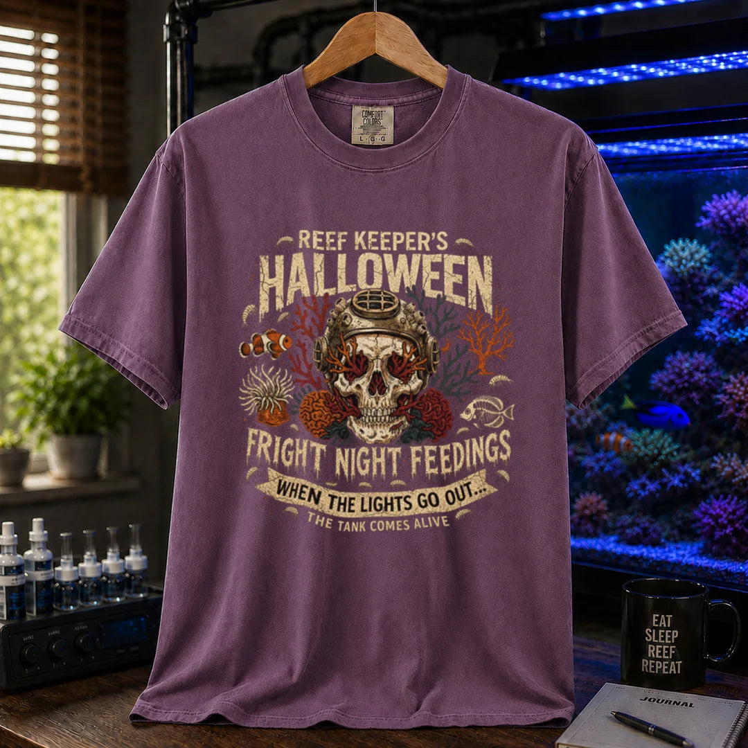 Saltwater aquarium graphic t-shirt design featuring distressed vintage typography reading Reef Keeper's Halloween Fright Night Feedings with a vintage diving helmet skull, amphipods, and a banner reading When The Lights Go Out... The Tank Comes Alive, purple crew neck tee