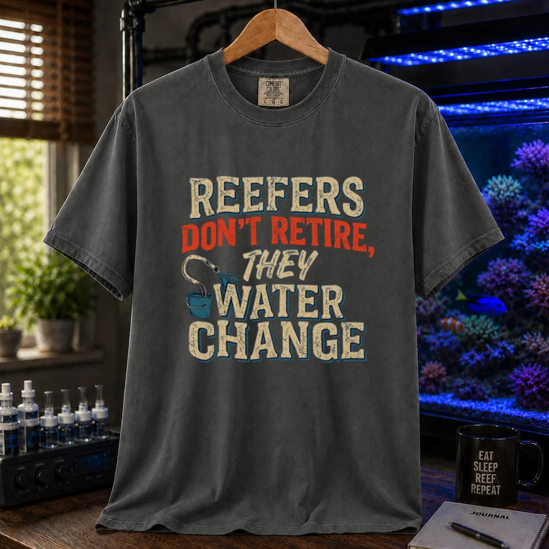 Saltwater aquarium graphic t-shirt design featuring distressed typography reading Reefers Don't Retire, They Water Change with a bucket and siphon illustration on a dark grey tee