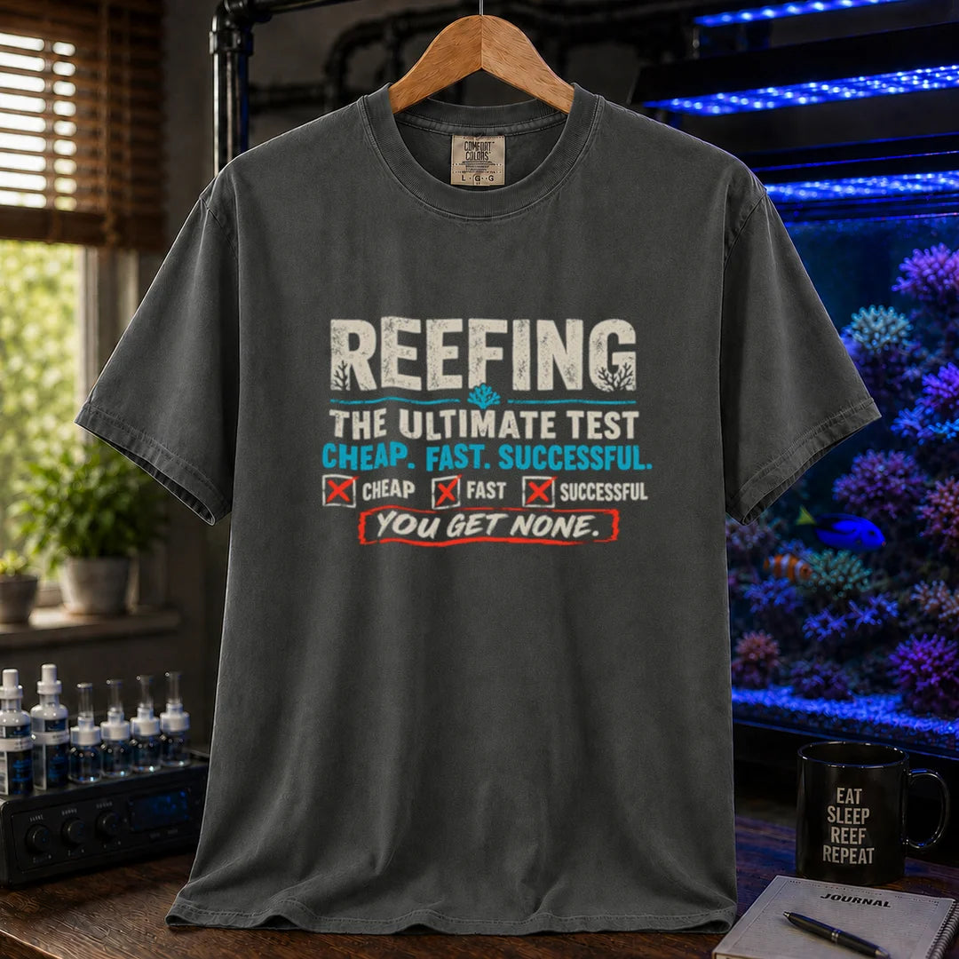 Saltwater aquarium graphic t-shirt design featuring distressed typography reading Reefing The Ultimate Test Cheap. Fast. Successful. with checkbox symbols and the punchline You Get None on a dark grey tee