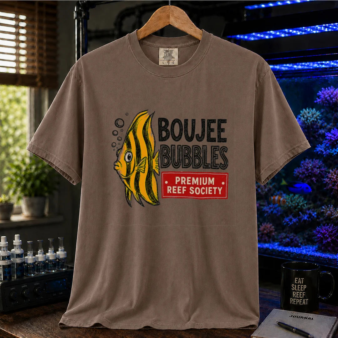 Saltwater aquarium graphic t-shirt featuring an illustration of a yellow striped fish blowing bubbles next to text reading Boujee Bubbles Premium Reef Society on a brown shirt