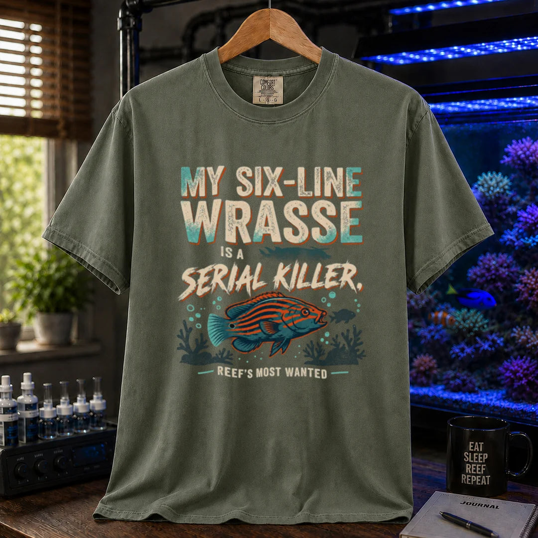 Saltwater aquarium graphic t-shirt featuring distressed typography reading My Six-Line Wrasse Is A Serial Killer with an illustration of a striped wrasse on a military green T-Shirt