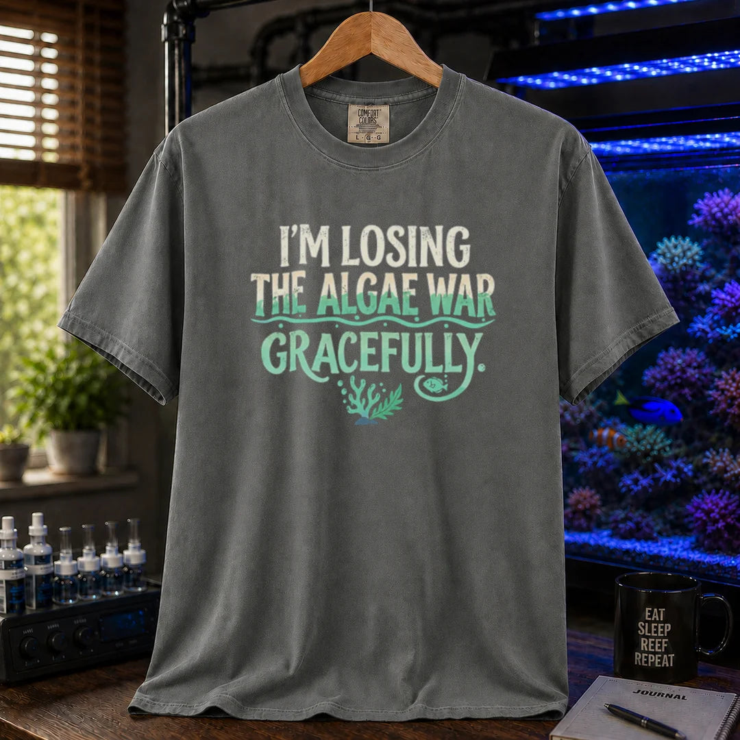 Saltwater aquarium graphic t-shirt featuring distressed typography reading I'm Losing The Algae War Gracefully with coral and fish illustrations on a grey T-Shirt