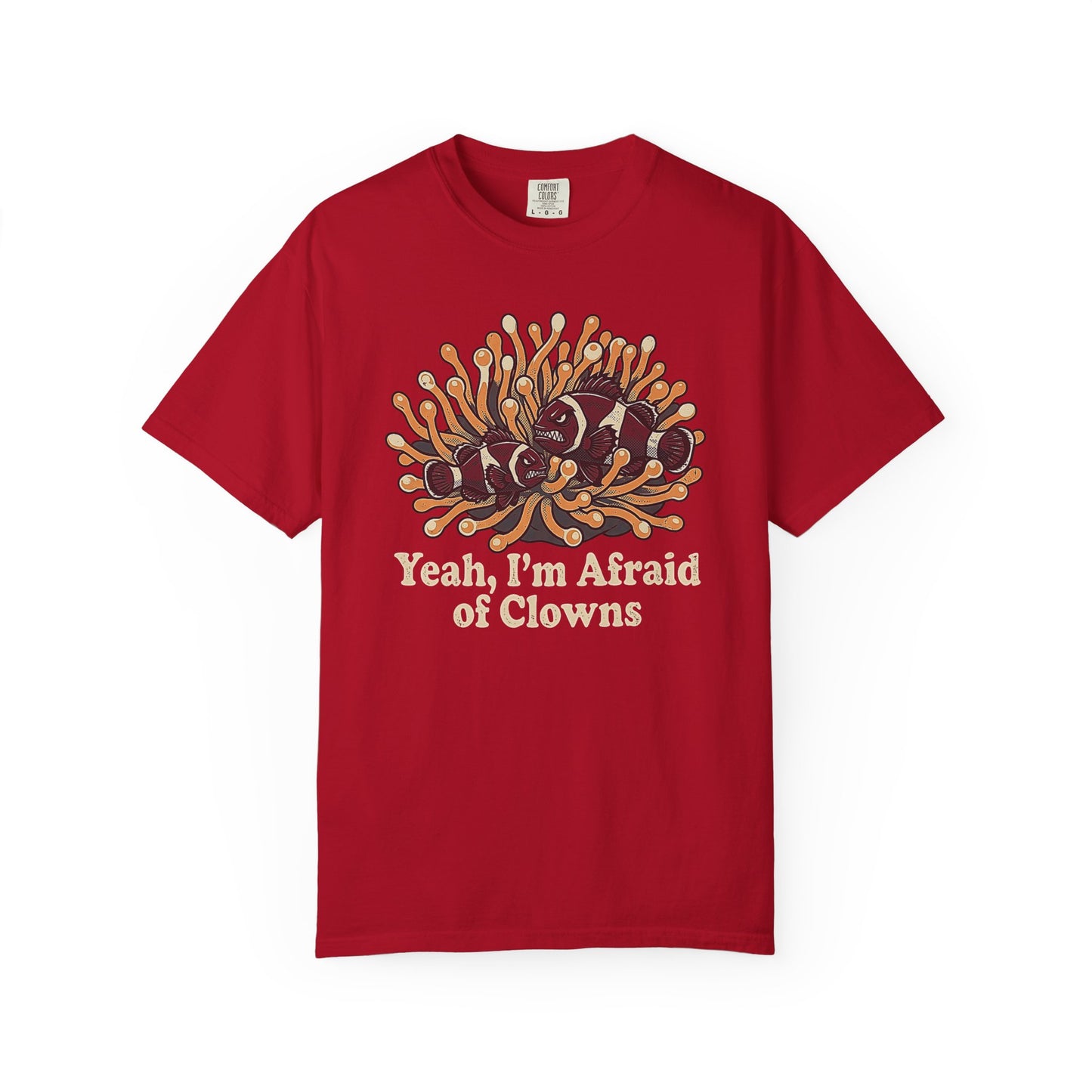 Broke Reefers saltwater aquarium graphic t-shirt featuring a humorous illustration of grumpy clownfish in an anemone with the text: YEAH, I’M AFRAID OF CLOWNS, red crew neck tee