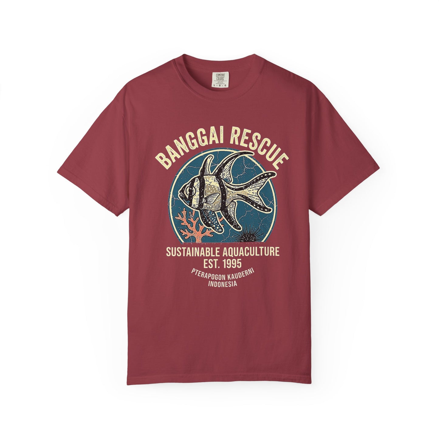 Broke Reefers saltwater aquarium graphic t-shirt featuring a detailed, vintage-style badge illustration of a Banggai Cardinalfish with the text: BANGGAI RESCUE SUSTAINABLE AQUACULTURE EST. 1995 PTERAPOGON KAUDERNI INDONESIA, maroon crew neck tee