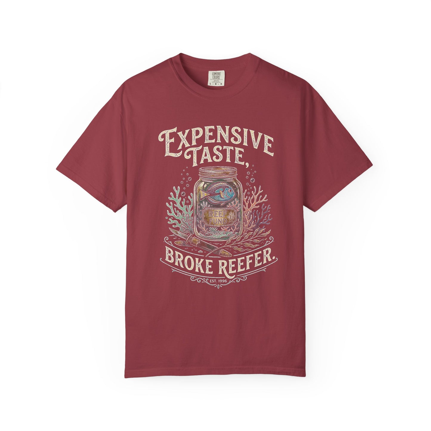 Broke Reefers saltwater aquarium graphic t-shirt featuring a detailed illustration of a fish in a jar with the text: EXPENSIVE TASTE, BROKE REEFER. EST. 1996, maroon crew neck tee