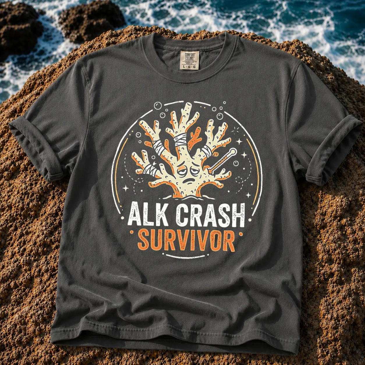 Broke Reefers saltwater aquarium graphic t-shirt featuring an expressive, bandaged coral illustration with the text: ALK CRASH SURVIVOR, dark khaki crew neck tee