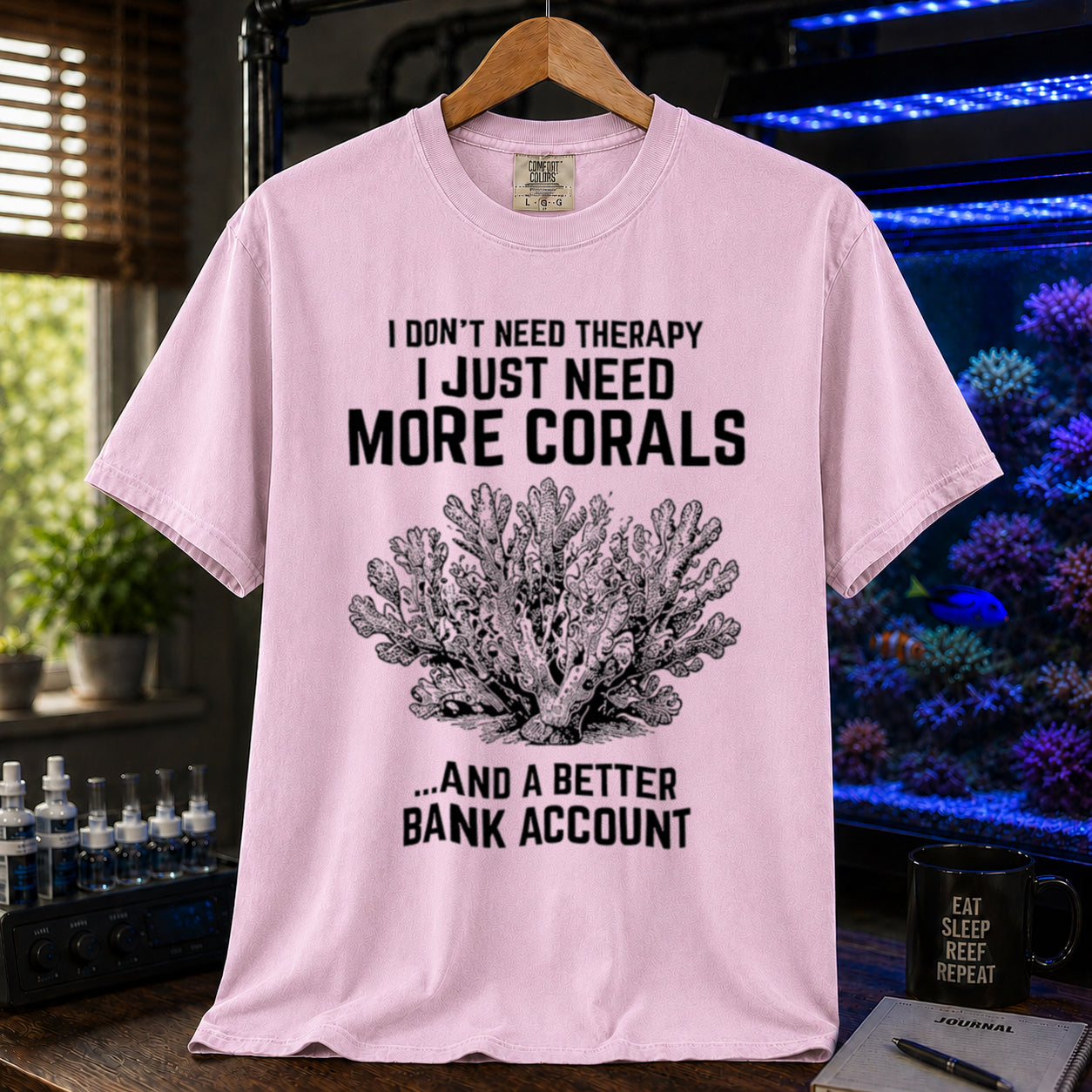 Broke Reefers saltwater aquarium graphic t-shirt featuring an intricate vintage coral illustration and bold text: I DON'T NEED THERAPY I JUST NEED MORE CORALS ...AND A BETTER BANK ACCOUNT, pink crew neck tee