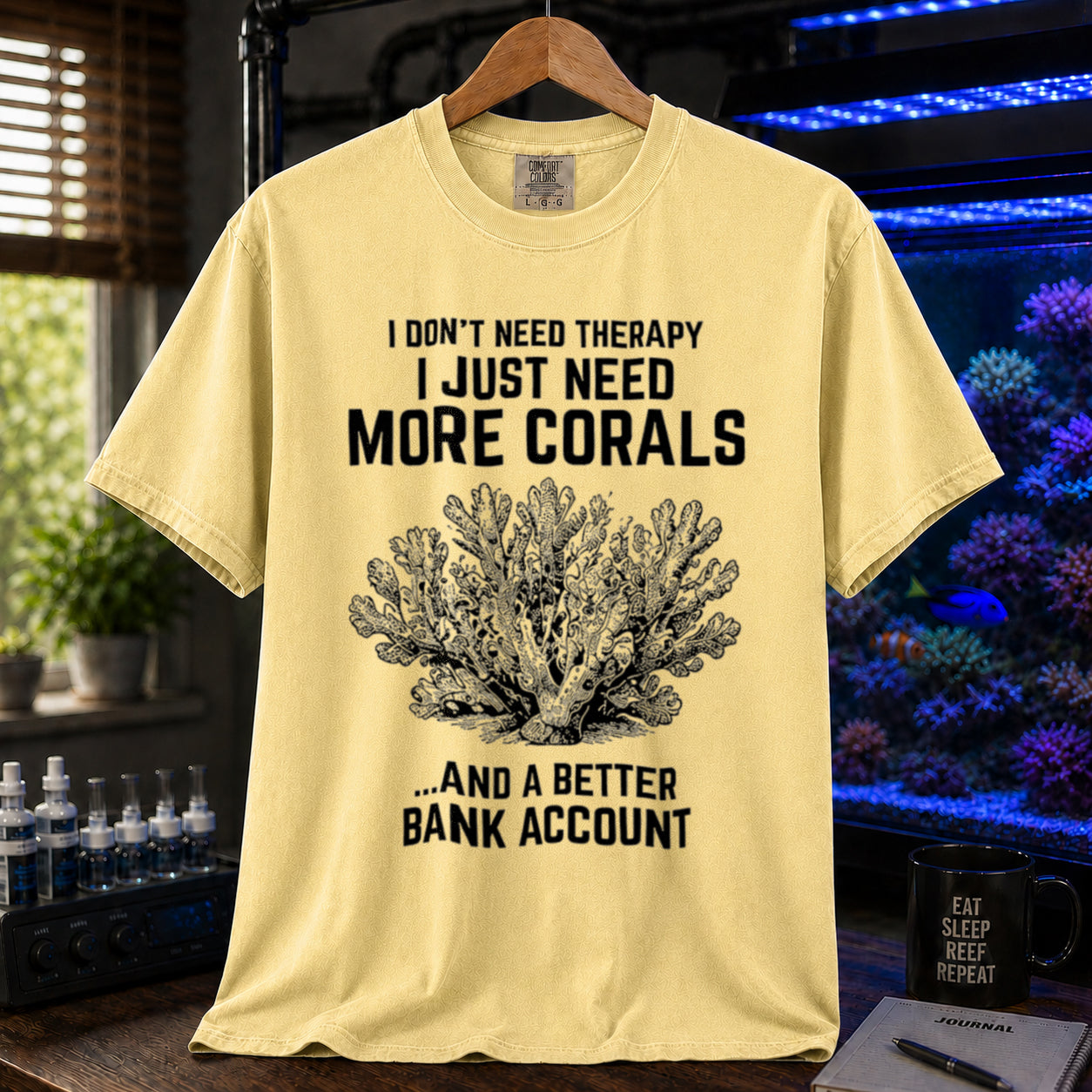 Broke Reefers saltwater aquarium graphic t-shirt featuring an intricate vintage coral illustration and bold text: I DON'T NEED THERAPY I JUST NEED MORE CORALS ...AND A BETTER BANK ACCOUNT, yellow crew neck tee