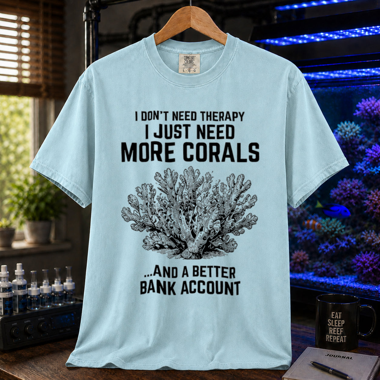 Broke Reefers saltwater aquarium graphic t-shirt featuring an intricate vintage coral illustration and bold text: I DON'T NEED THERAPY I JUST NEED MORE CORALS ...AND A BETTER BANK ACCOUNT, light blue crew neck tee