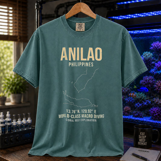 Saltwater aquarium graphic t-shirt featuring a map outline of Anilao, Philippines, coordinates, and the text: ANILAO PHILIPPINES, 13.76 N, 120.92 E, WORLD-CLASS MACRO DIVING, CORAL REEF EXPLORATION, green crew neck tee