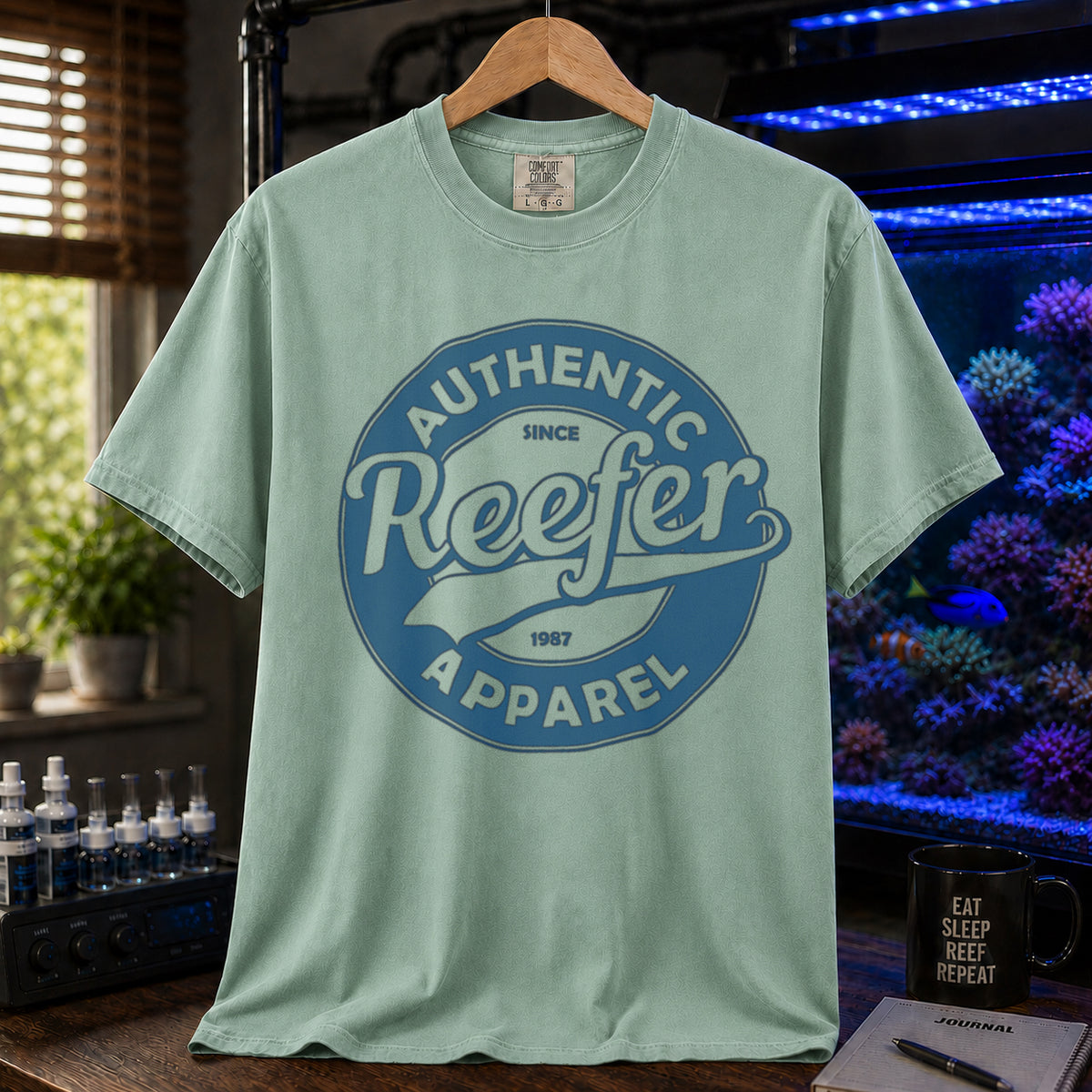 Saltwater aquarium graphic t-shirt featuring a retro circular athletic seal and text: AUTHENTIC, SINCE 1987, Reefer, APPAREL, light green crew neck tee