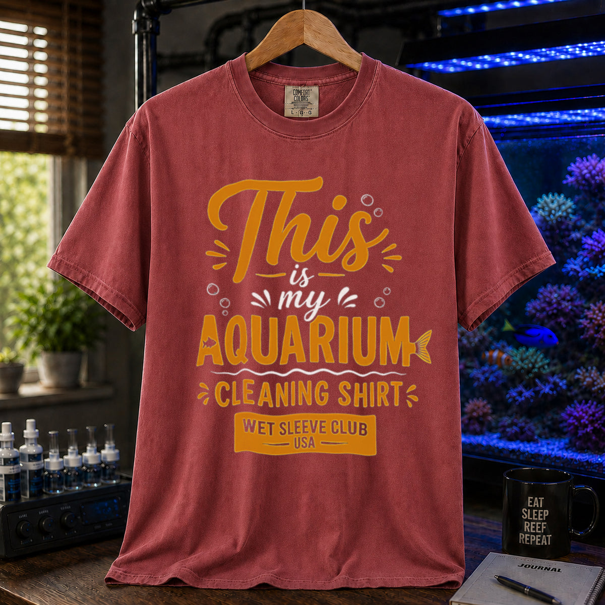 Saltwater aquarium graphic t-shirt featuring bold gold and white text: THIS IS MY AQUARIUM CLEANING SHIRT, WET SLEEVE CLUB USA, maroon crew neck tee