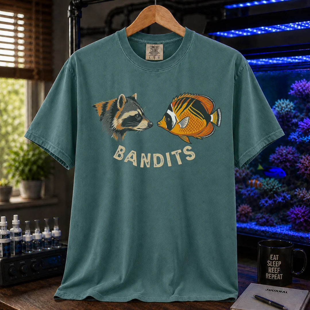 Saltwater aquarium graphic t-shirt featuring a vintage illustration of a raccoon and a Bandit Angelfish face-to-face with the text: BANDITS, green crew neck tee