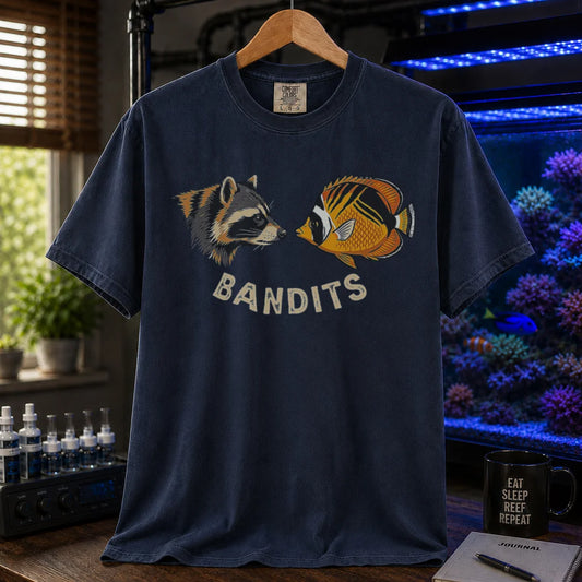 Saltwater aquarium graphic t-shirt featuring a vintage illustration of a raccoon and a Bandit Angelfish face-to-face with the text: BANDITS, navy crew neck tee