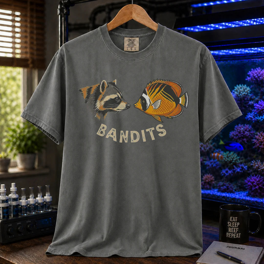 Saltwater aquarium graphic t-shirt featuring a vintage illustration of a raccoon and a Bandit Angelfish face-to-face with the text: BANDITS, khaki crew neck tee