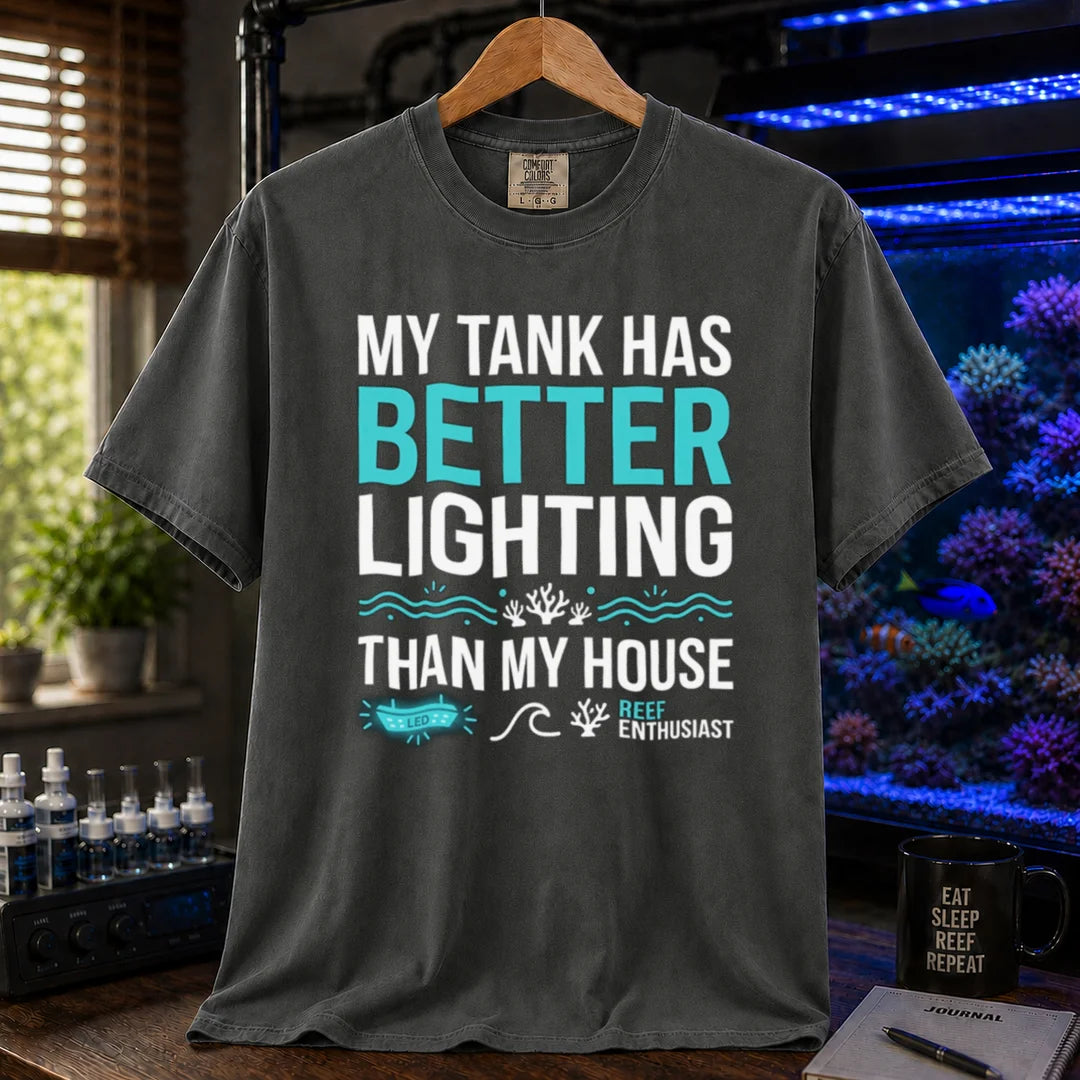 Saltwater aquarium graphic t-shirt featuring bold typography and reef icons with the text: MY TANK HAS BETTER LIGHTING THAN MY HOUSE,  khaki crew neck tee