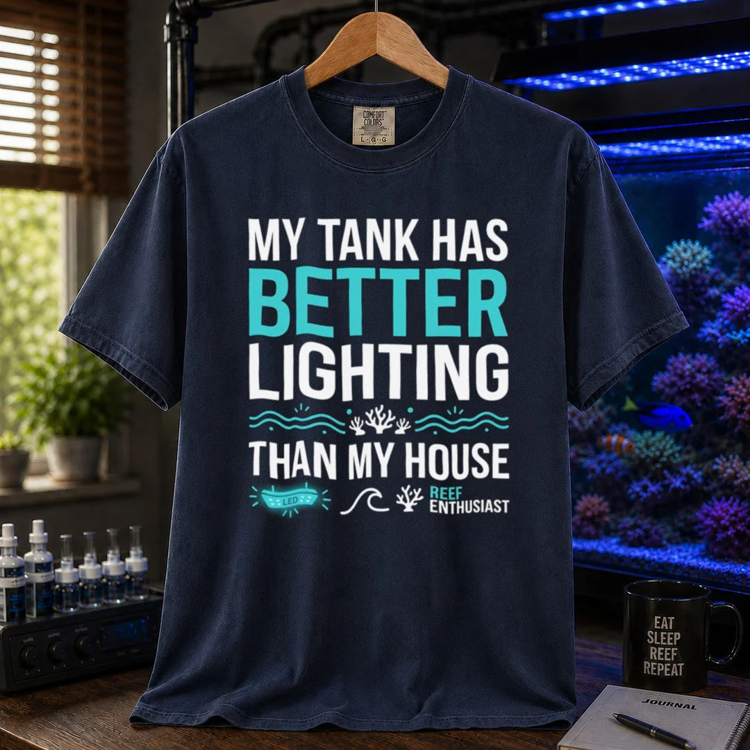 Saltwater aquarium graphic t-shirt featuring bold typography and reef icons with the text: MY TANK HAS BETTER LIGHTING THAN MY HOUSE,    navy crew neck tee