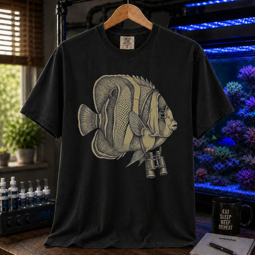 Saltwater aquarium graphic t-shirt featuring a vintage stippled illustration of a hybrid Copperband Butterflyfish wearing binoculars around its neck, black crew neck tee