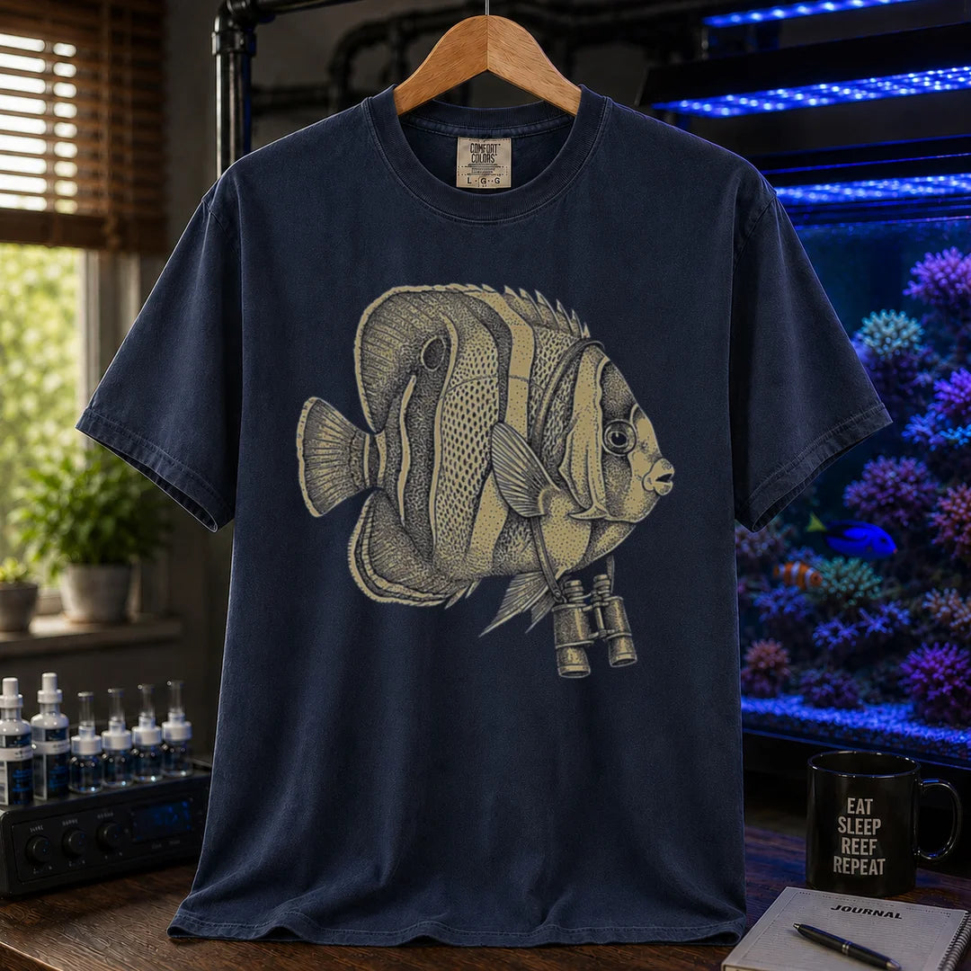 Saltwater aquarium graphic t-shirt featuring a vintage stippled illustration of a hybrid Copperband Butterflyfish wearing binoculars around its neck, navy crew neck tee