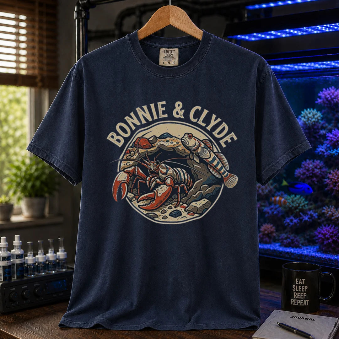 Saltwater aquarium graphic t-shirt featuring a retro emblem of a pistol shrimp and goby in a rock cave and text: BONNIE & CLYDE, navy crew neck tee