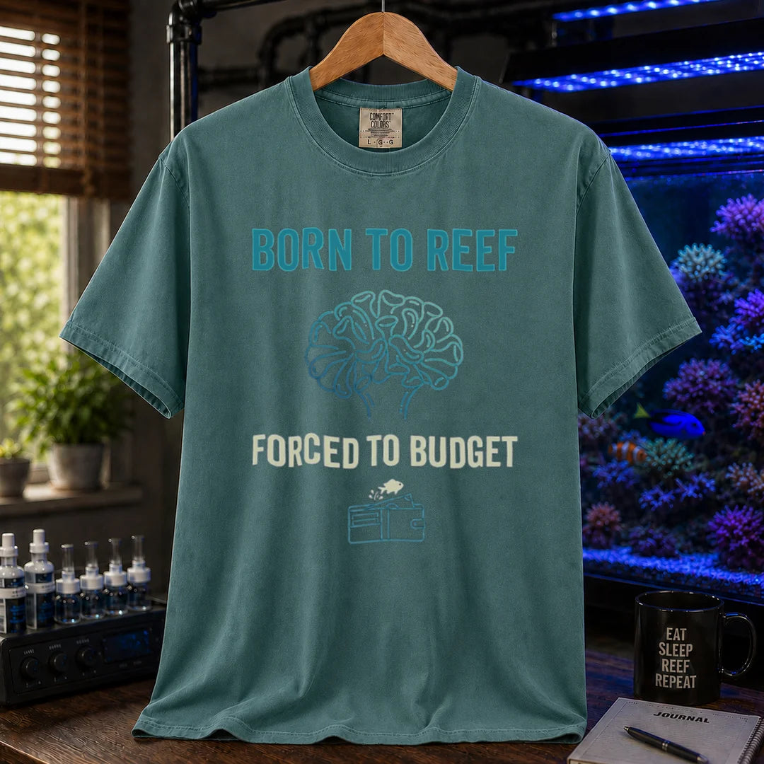 Saltwater aquarium graphic t-shirt featuring brain coral art, a wallet icon, and text: BORN TO REEF, FORCED TO BUDGET, green crew neck tee